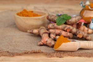 Turmeric Herb Yellow Powder And Fresh Turmeric.