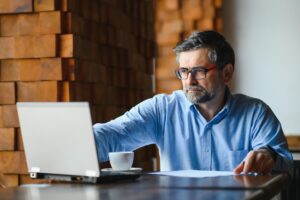 man doing research on semax peptide on his laptop
